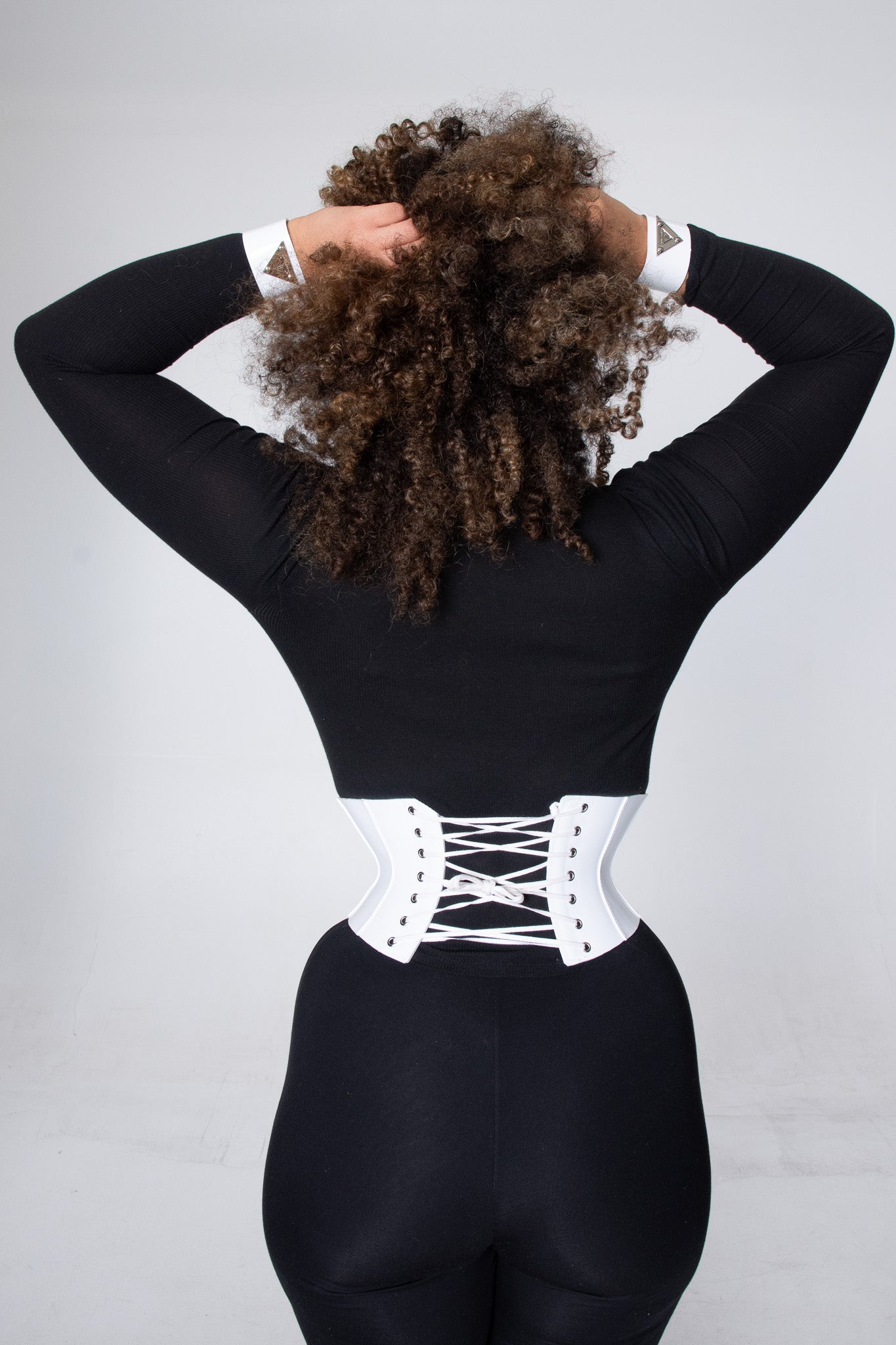 Trendy Violetta corset belt crafted from glossy white material, perfect for enhancing curves