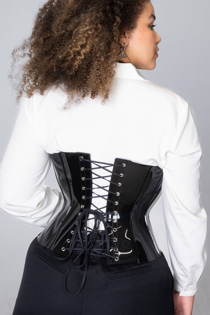 Chic and stylish black vinyl corset, crafted for a sleek and modern unisex look