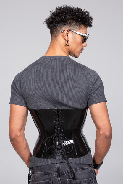 Fashion-forward corset made from shiny black vinyl material, exuding confidence and style for both genders