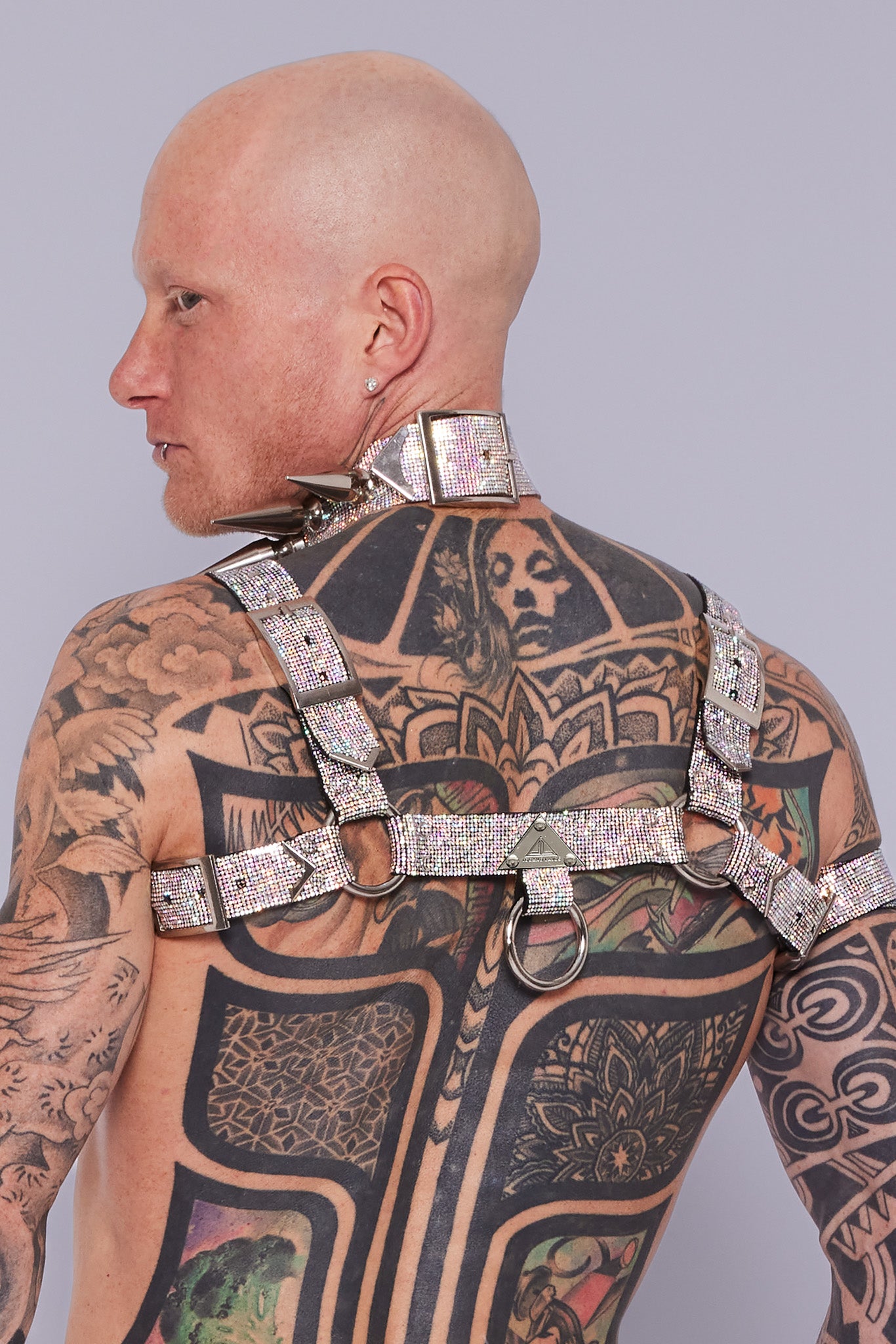 Bold and colorful H-Harness adorned with sparkling crystals, designed to make a statement and showcase your individuality at gay parties and events.