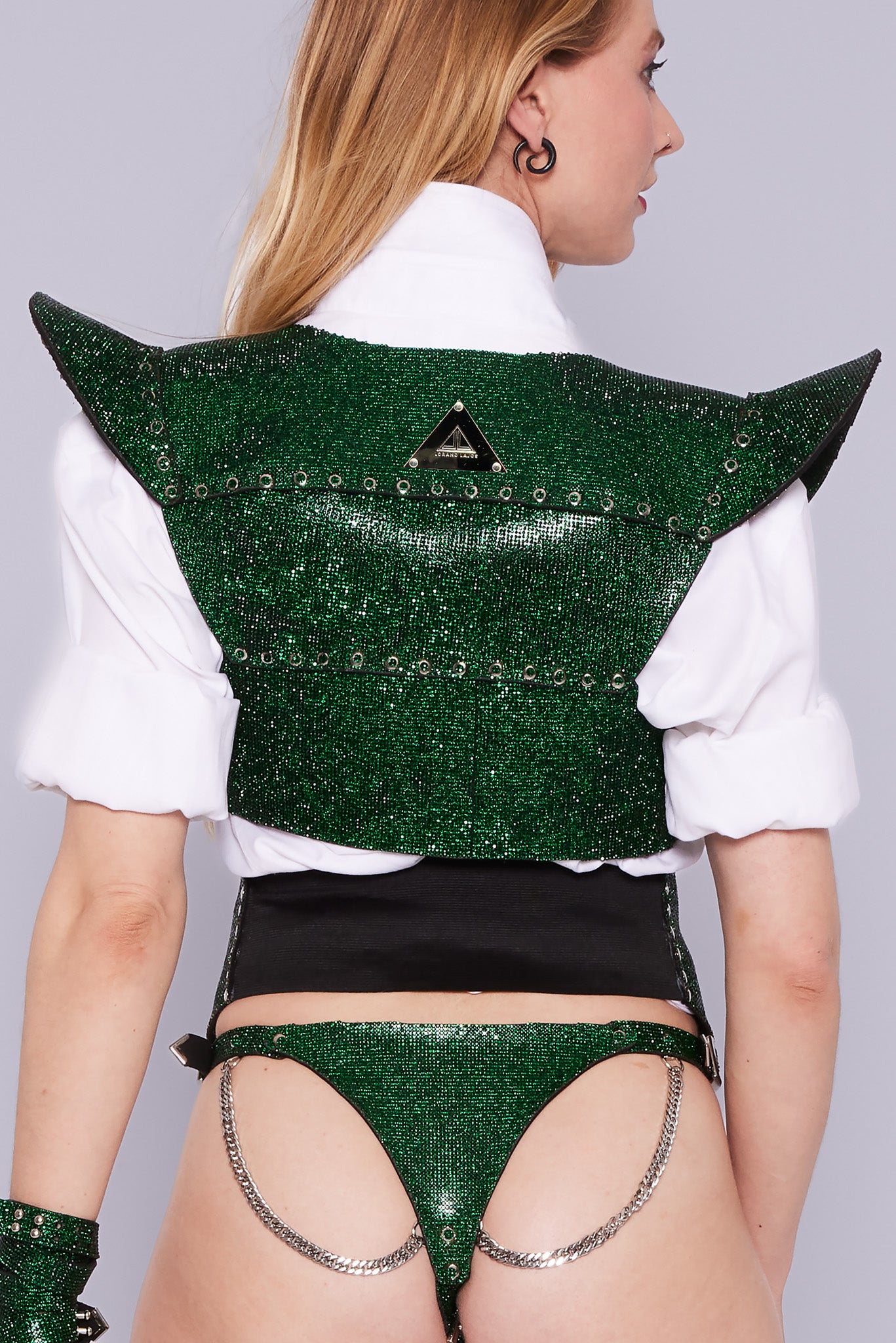 Chic short jacket with a modern twist, made from luxurious emerald green crystal fabric