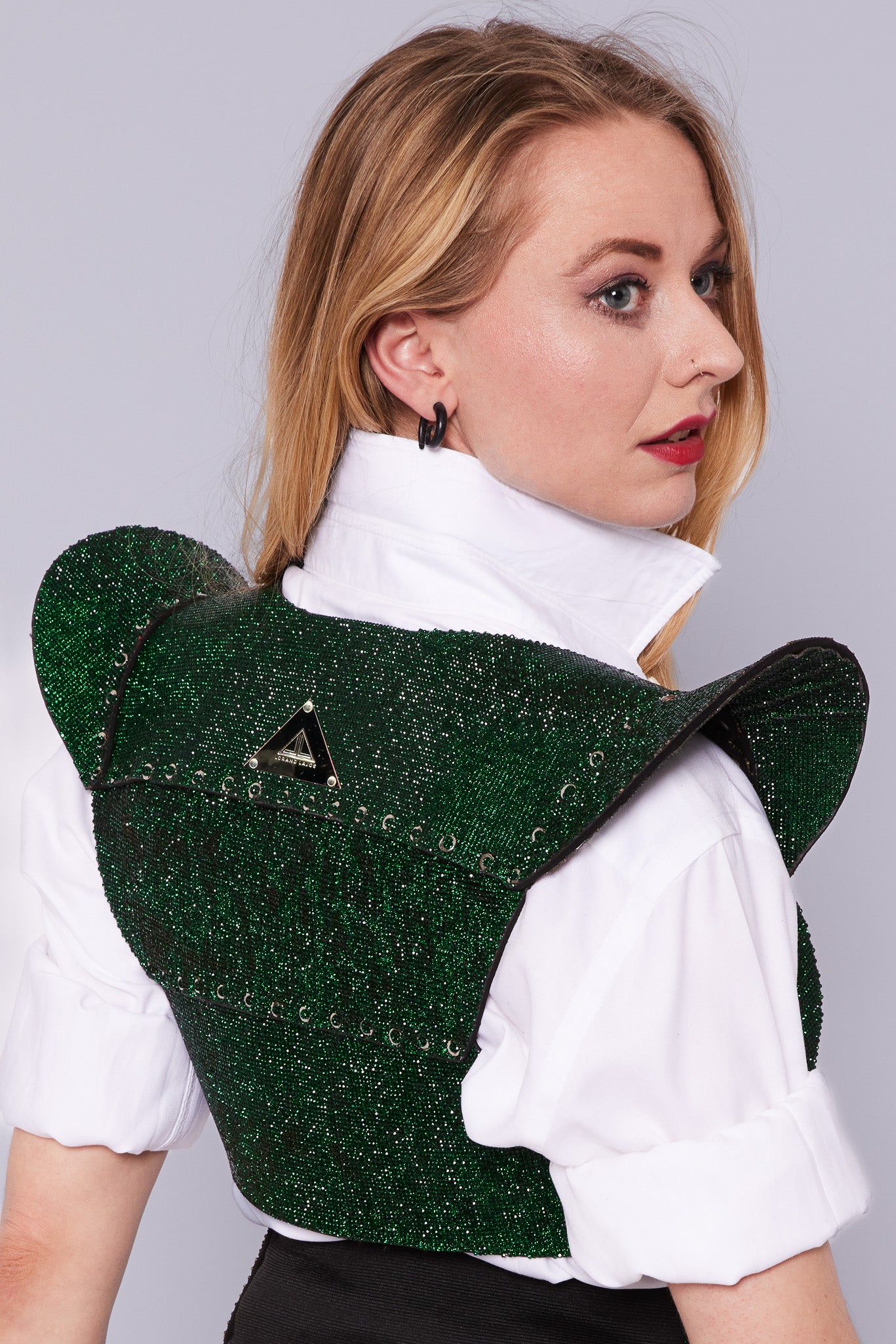 Elegant PAGODA Jacket showcasing a cropped design and eye-catching emerald green crystal fabric